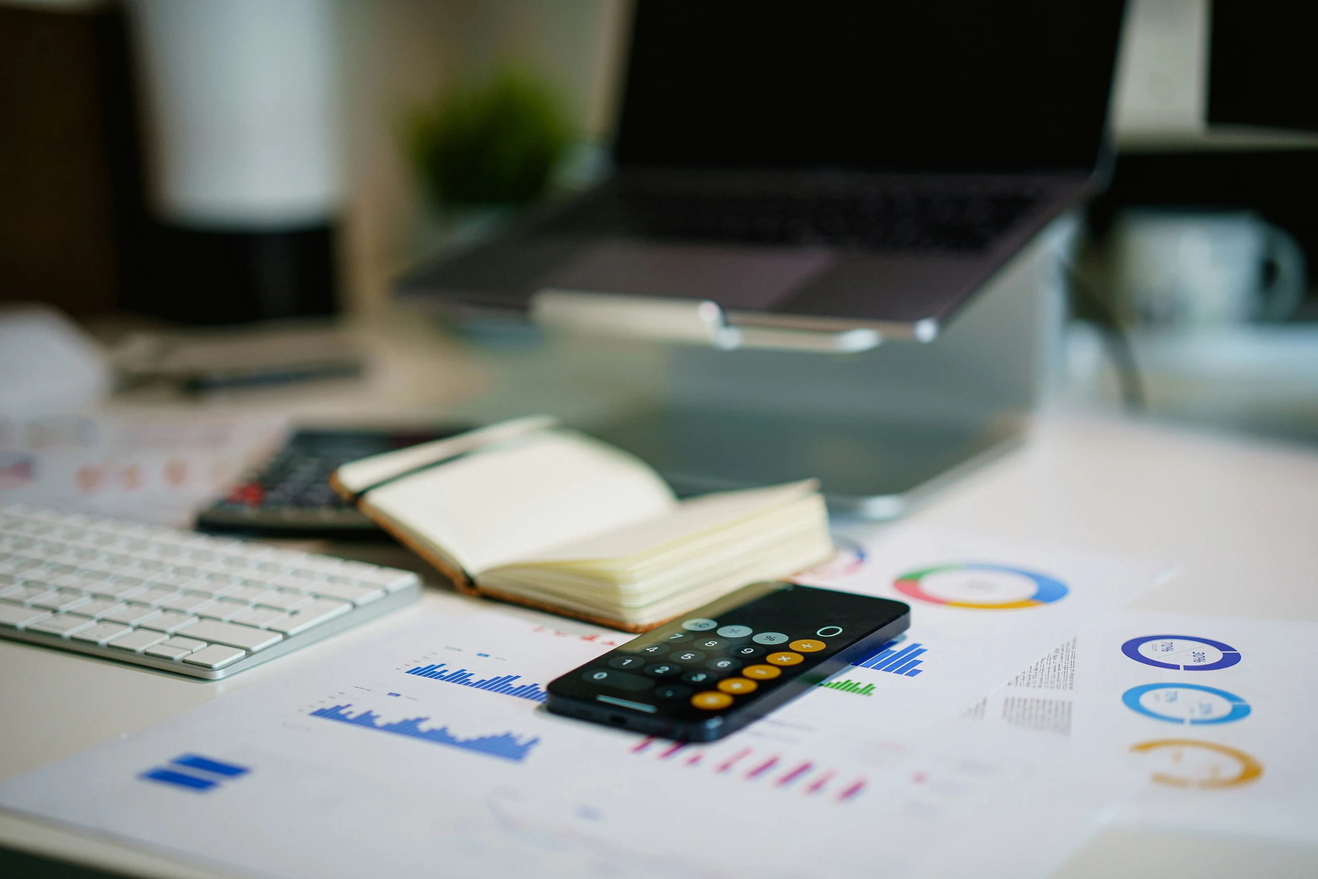 Financial reports and a calculator on an analysis worktable